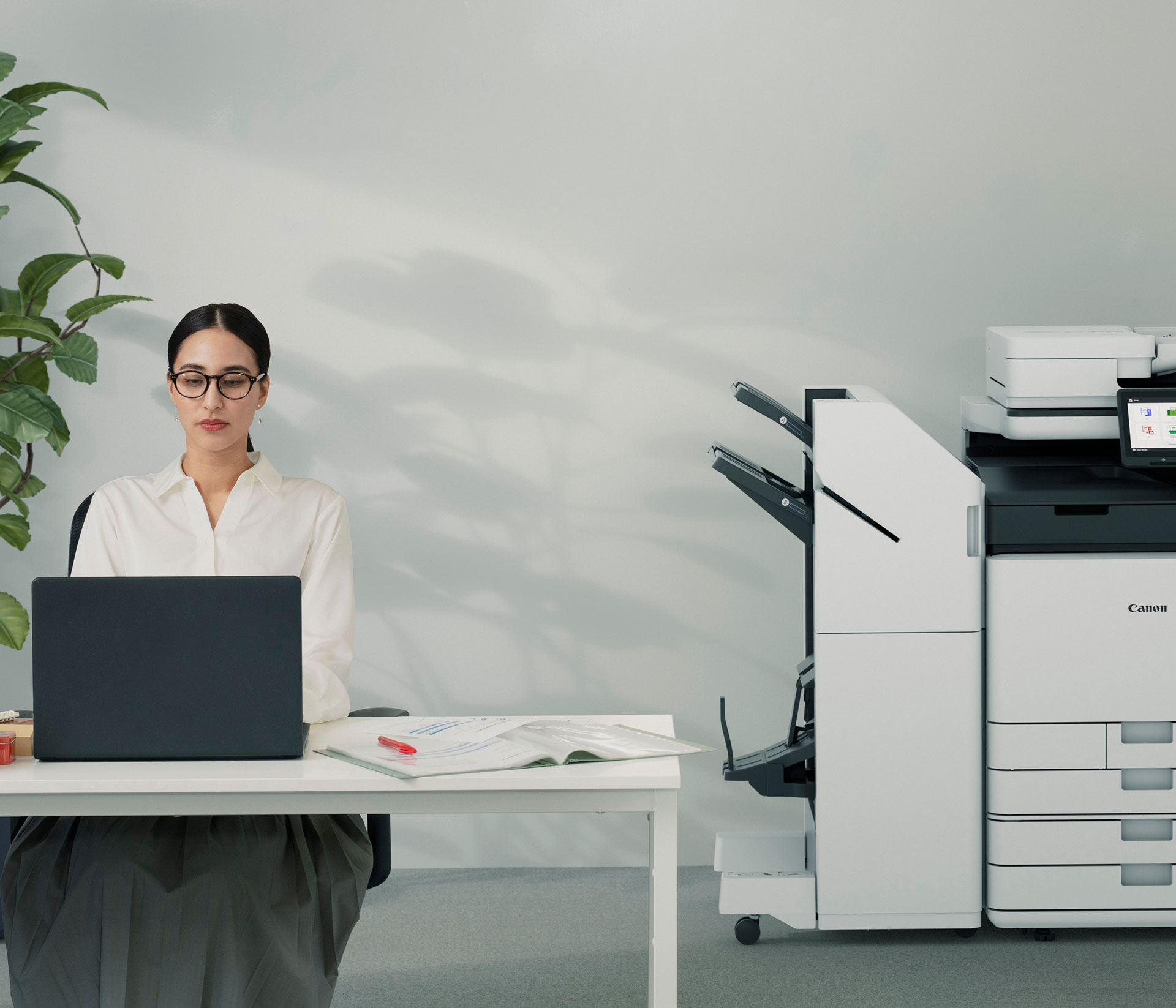 Canon imagerunner in an office with woman working in the foreground