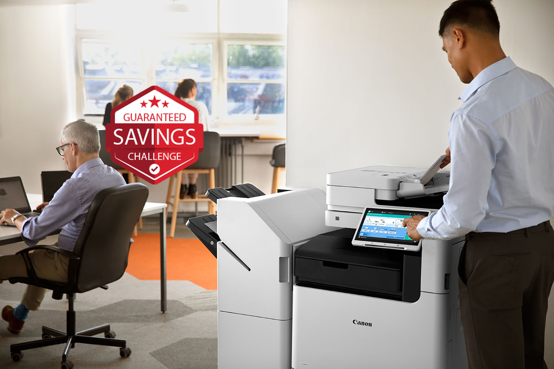 Canon imageRUNNER in an office with a guaranteed savings challenge badge