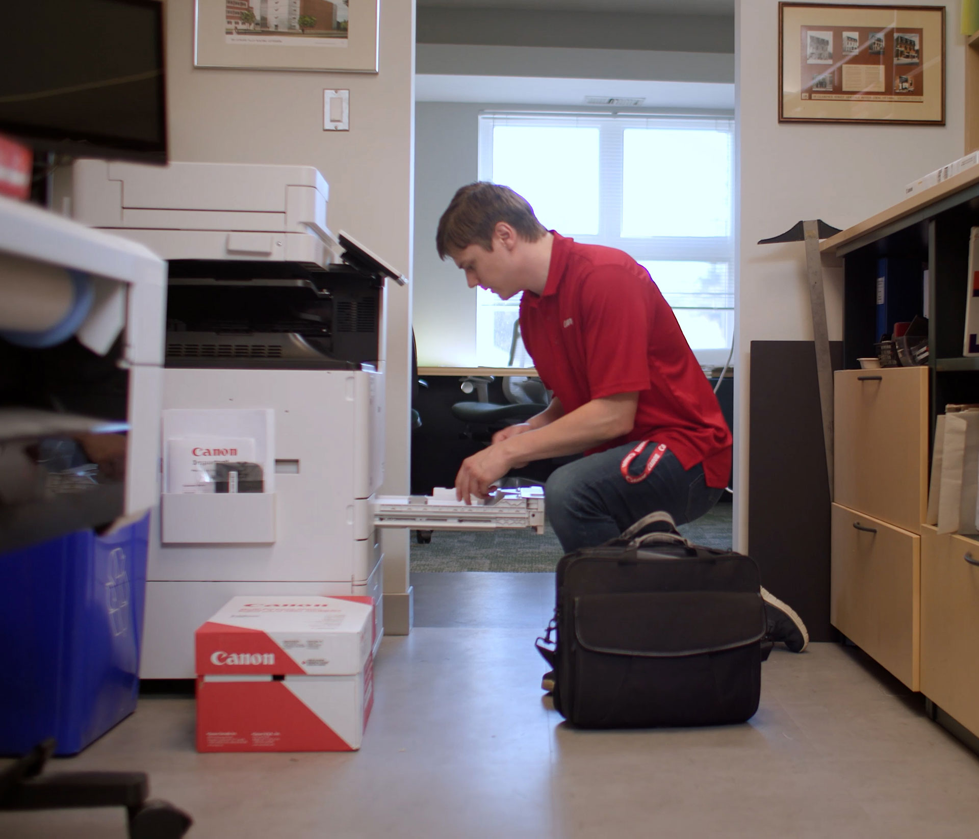 Canon service technician working on an imageRUNNER