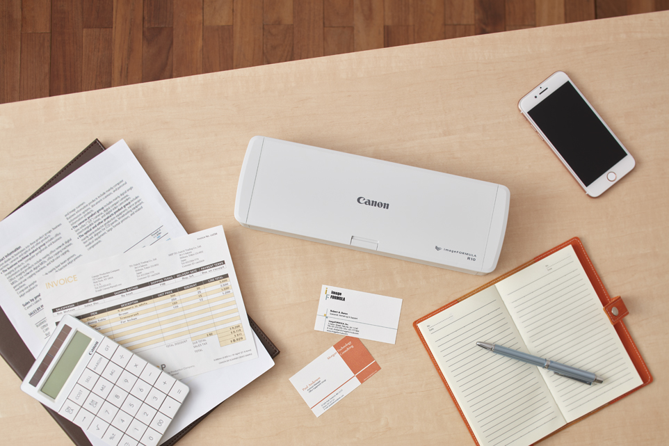 imageFORMULA R10 on a desk with office items